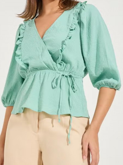 Save 65% with Noon deals on Styli Green Ruffle Blouse and add more with Noon coupon